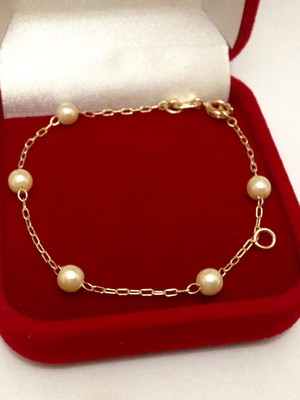 Pulseira dourado em perola baby