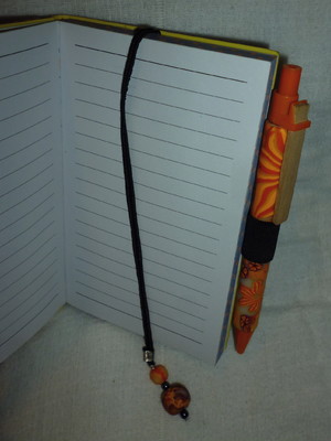 Caderninho com caneta laranja floral 2 esgotado