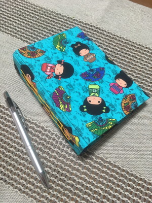 Caderno a6 com lombada costurada