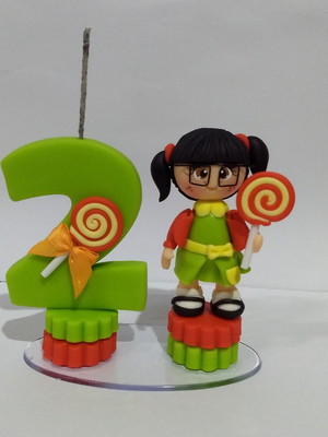 Vela chiquinha em biscuit