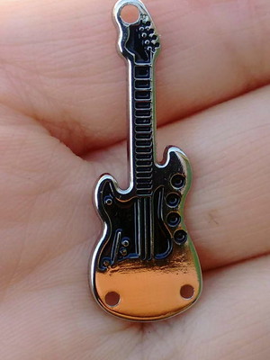 Pingente clave de sol banhado em ouro.