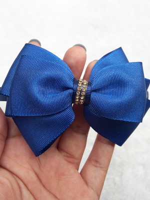 Tiara com laço azul e strass infantil