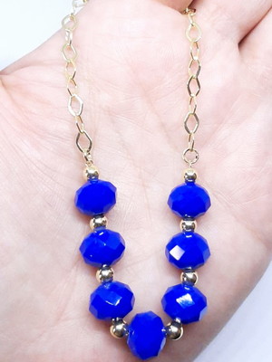 Pulseira cristal azul bic com bolinha dourada