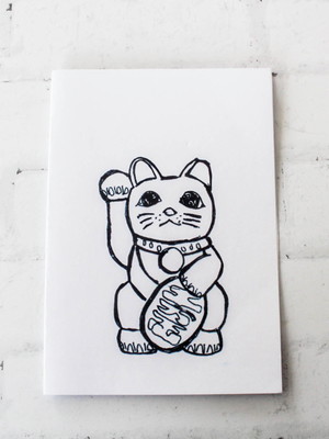 Caderno com estampa manekineko