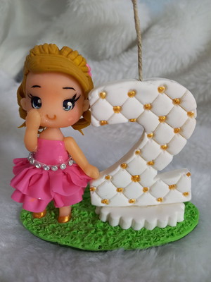 Vela personalizada em biscuit loira e morena