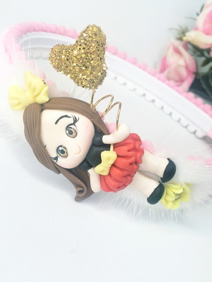 Tiara inverno com aplique de biscuit e pompons