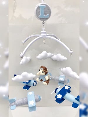 Mobile urso aviador para berço