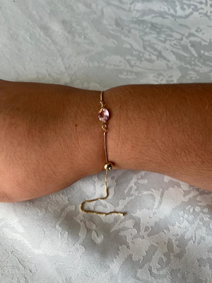 Pulseira dourada com pedras rosa (ajustável)