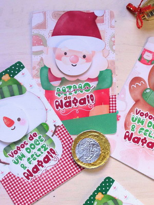 Cartão com moeda de chocolate natal