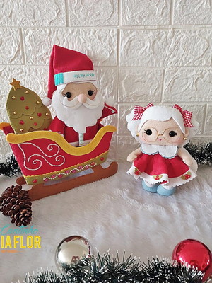 Papai e mamãe noel no trenó