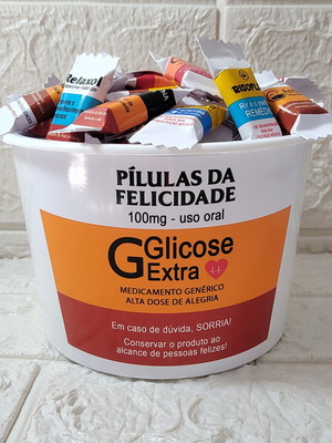Baldinho com 100 balas pílulas da felicidade
