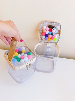 Maleta no plástico cristal com pompom
