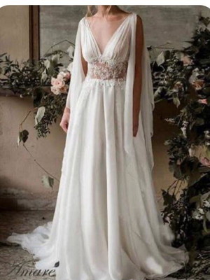 Vestido de noiva com mangas estilo capa