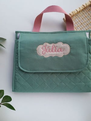 Trocador portátil com bolsos