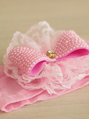 Faixa de cabelo rosa com laço