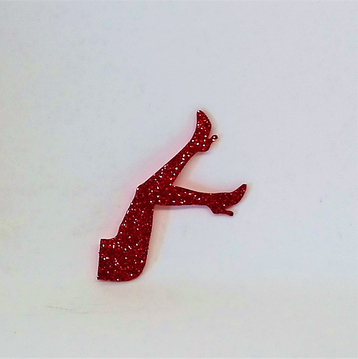 Imagem (fonte): https://www.elo7.com.br/aplique-em-eva-com-glitter-pernas-para-o-ar-6cm/dp/C25B7E